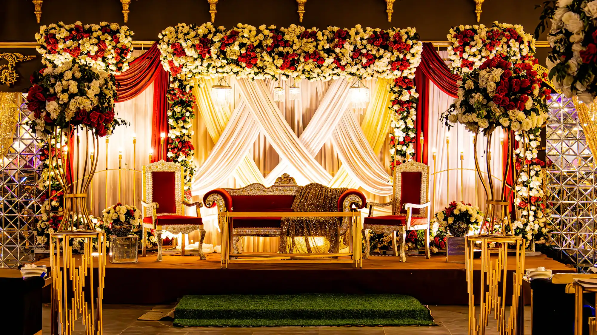 Event Planner - Gold and red floral wedding stage with ornate seating and drapes